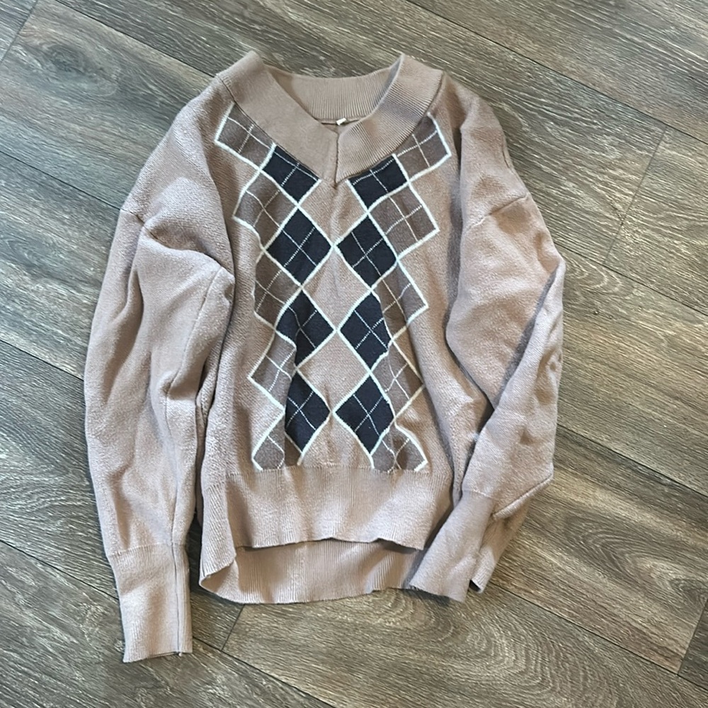 A brown plaid sweater